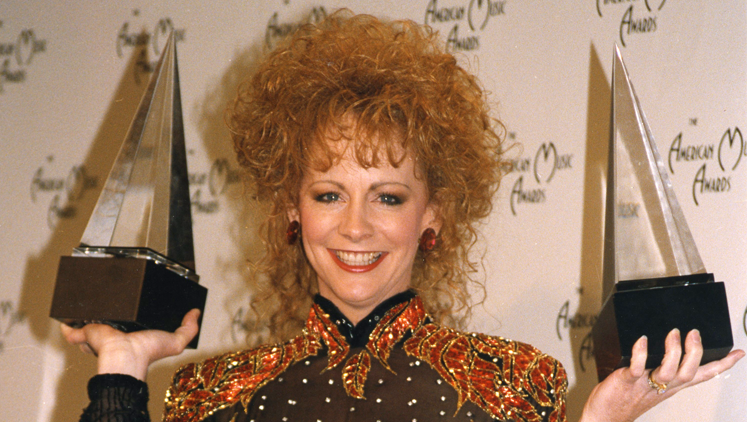 Reba holding awards 